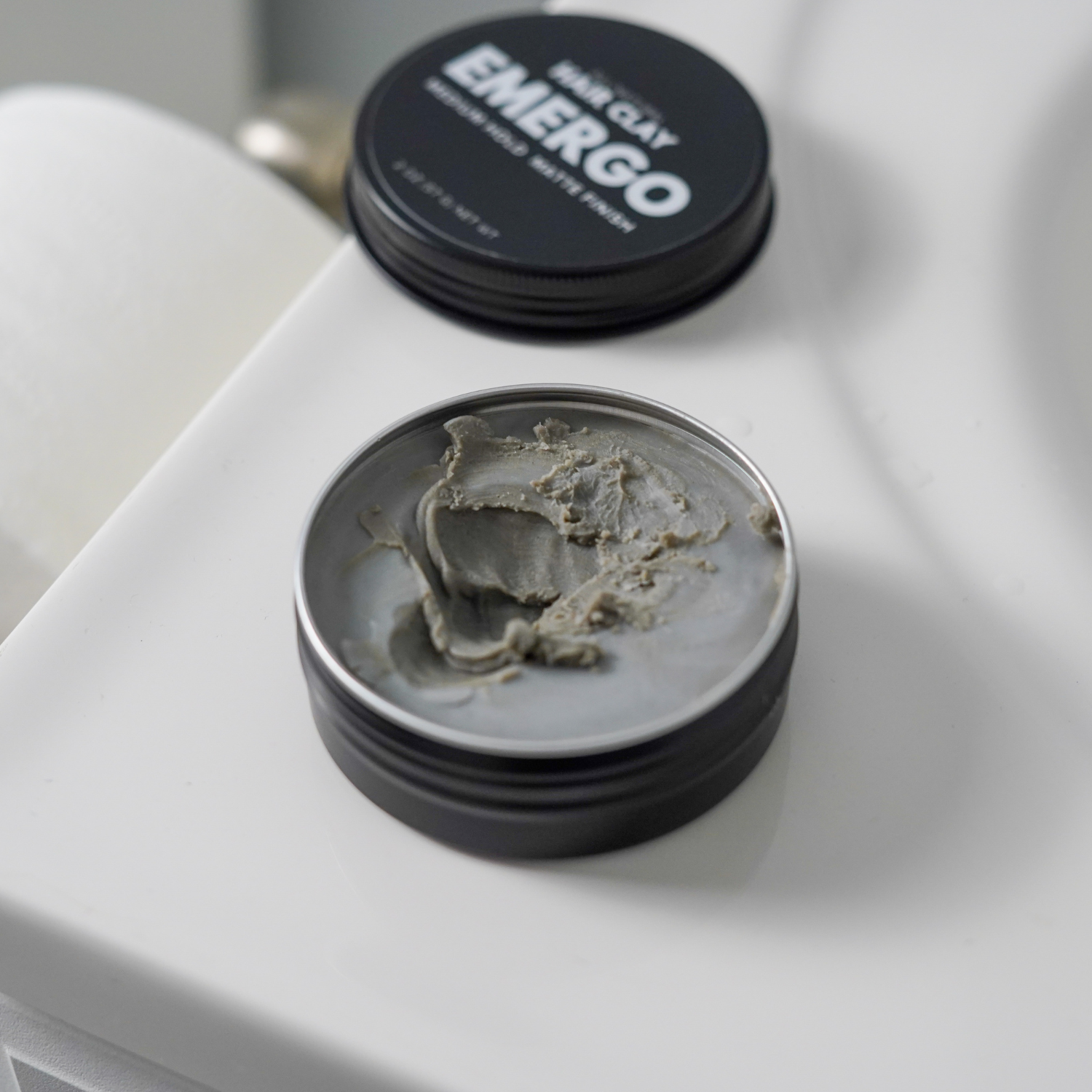 Hair clay open container on counter